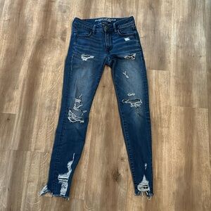 American Eagle Outfitters Super Stretch Jegging  Size 0  Blue Distressed!Raw hem